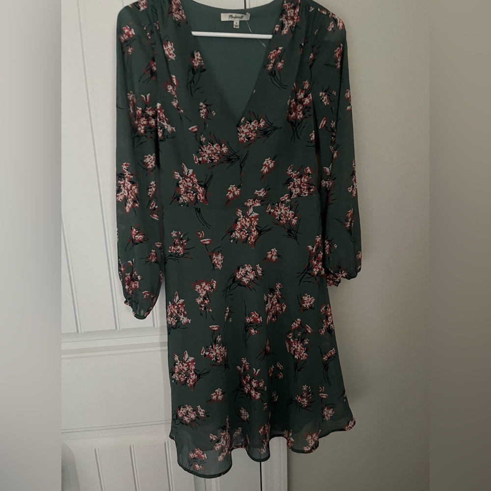 Green dress with red and white floral design and sheer sleeves